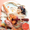 A Girl Practicing Guitar and Smiling Happily